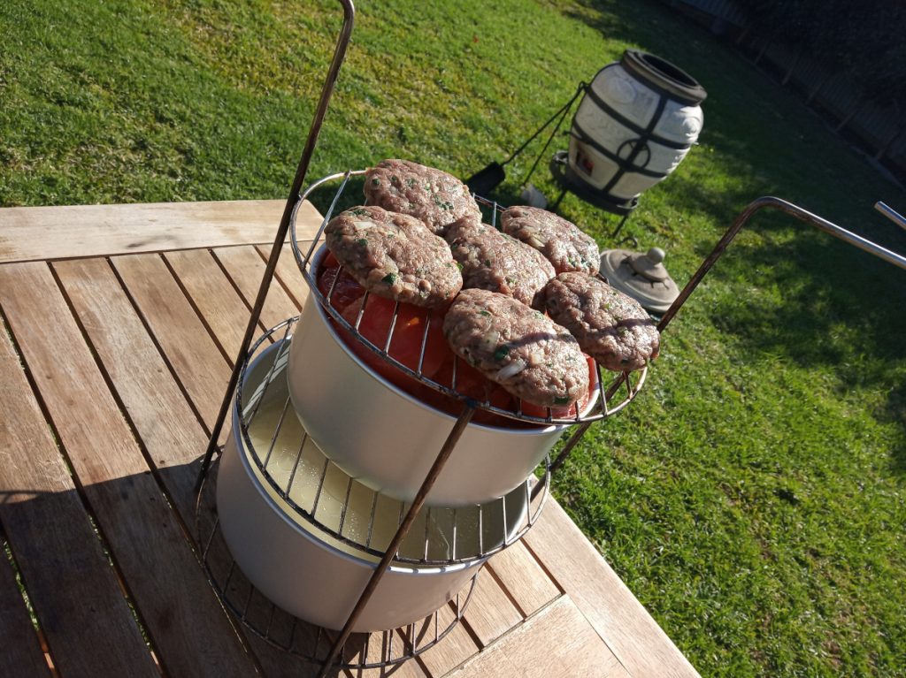 Tepsi Baytinijan, rice and additional meat patties layered on 3-tier rack included with your Artisan Tandoor oven